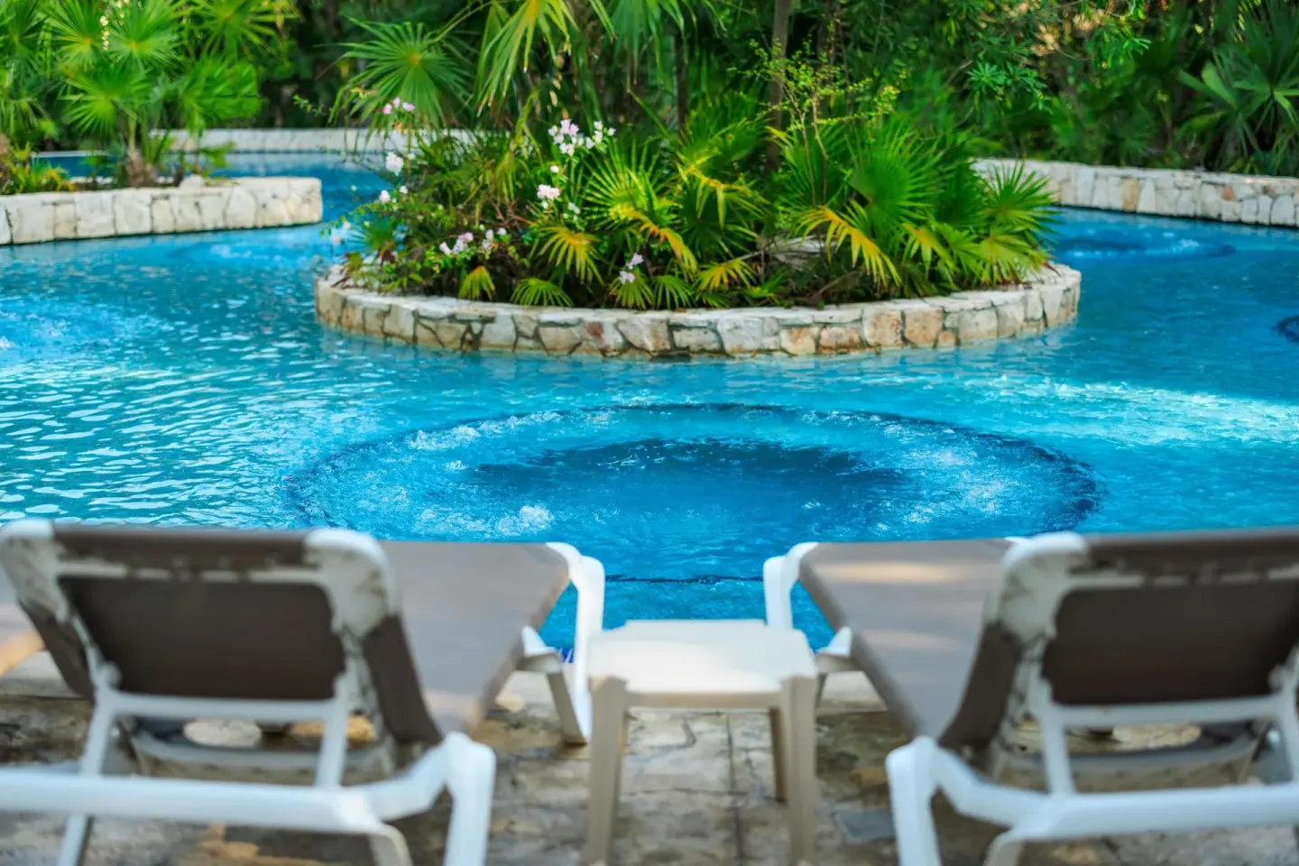 Bubbling spa area in a tropical pool at Occidental at Xcaret Destination.