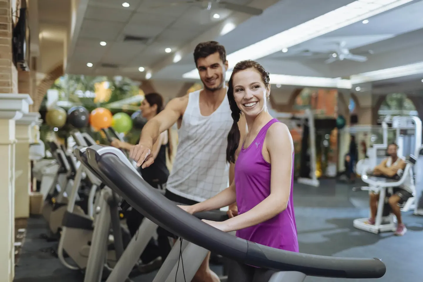 Guests using treadmills in the fitness center at Occidental at Xcaret Destination.