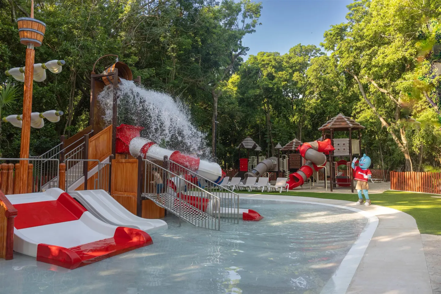 Water pours over slides in the kids' splash pool at Occidental at Xcaret Destination.