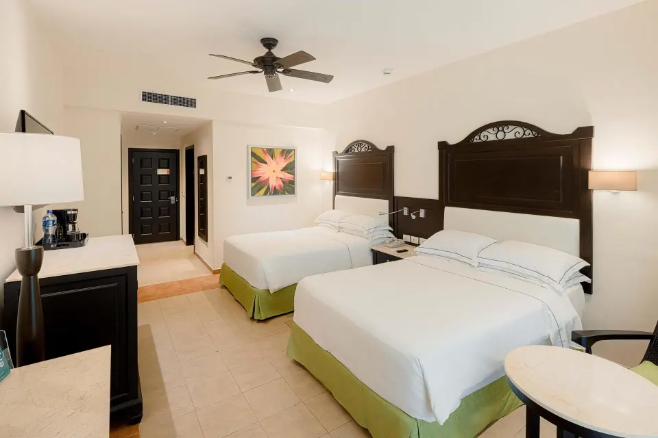 Deluxe Concierge Room with two beds and entry at Occidental at Xcaret Destination.
