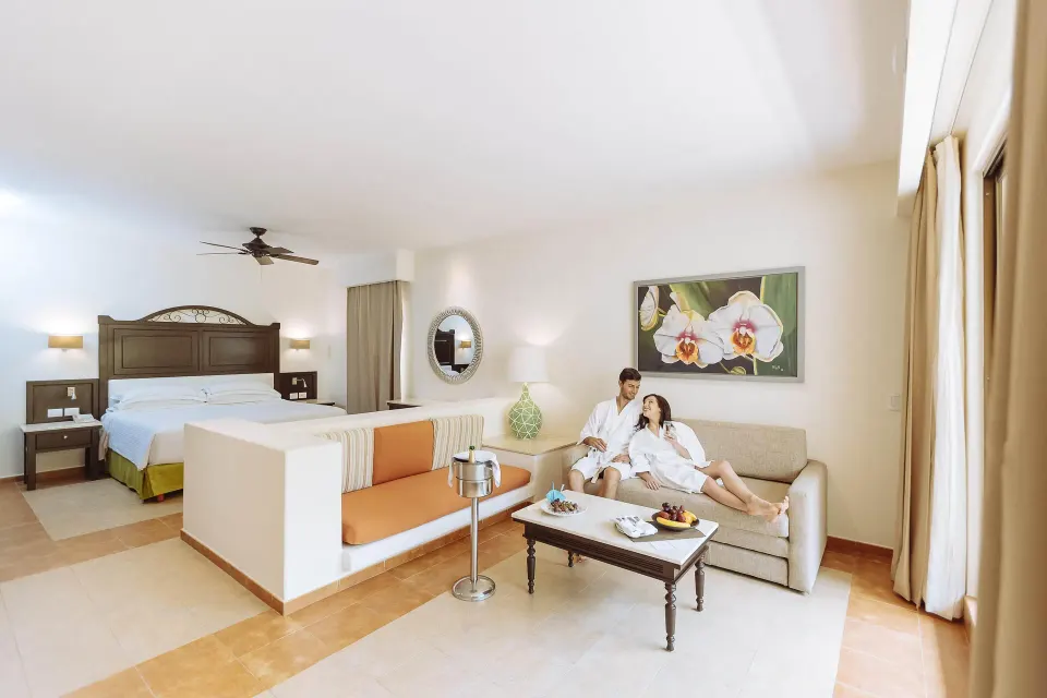 Junior Studio Suite with king bed and lounge sofa at Occidental at Xcaret Destination.
