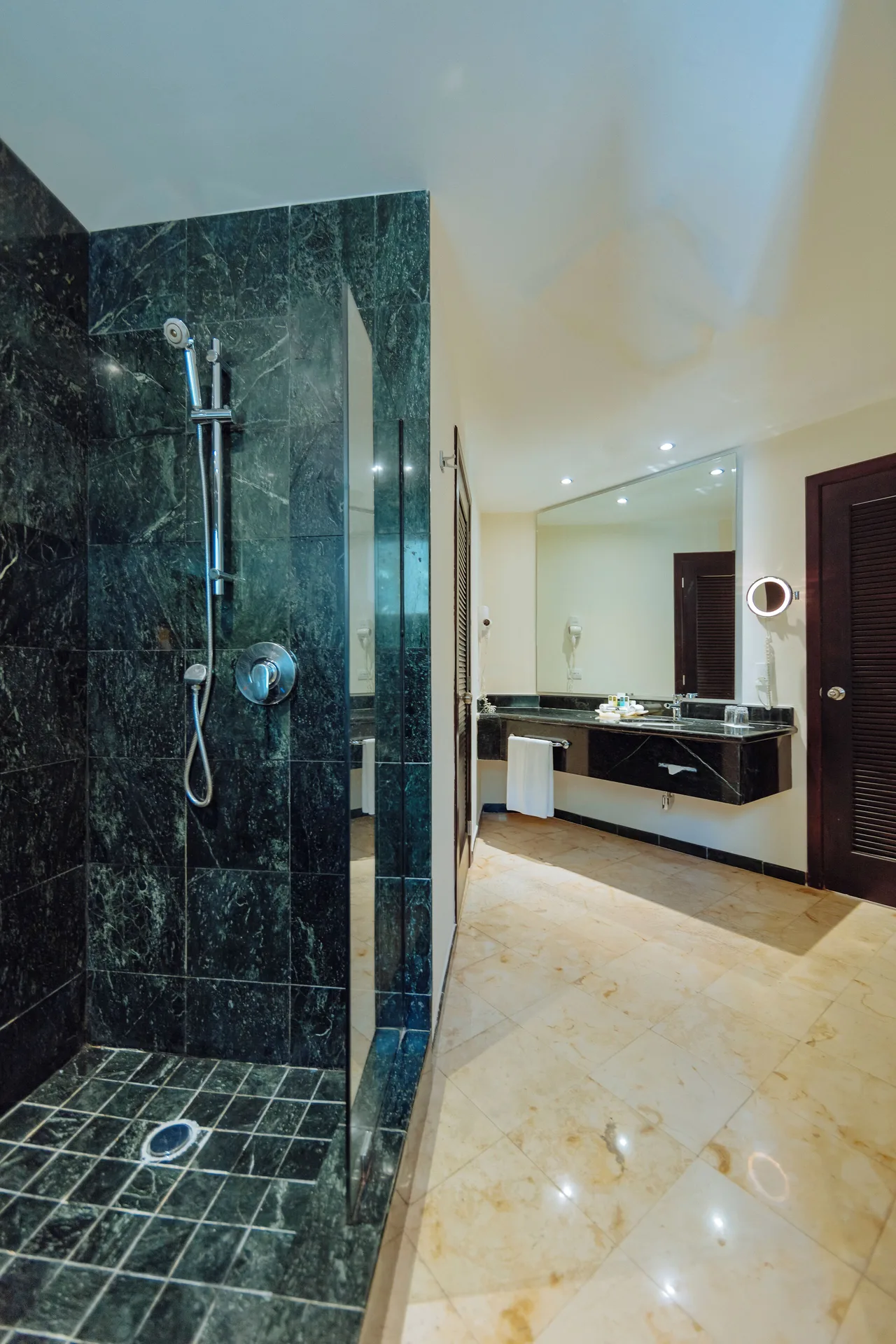 Luxury Room Royal Level bathroom with walk-in shower and vanity at Occidental at Xcaret Destination.