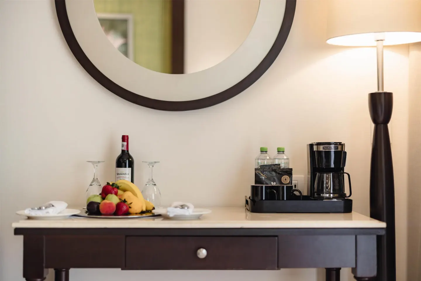 Royal Suite refreshment console with fruit, wine, water and coffee maker at Occidental at Xcaret Destination.