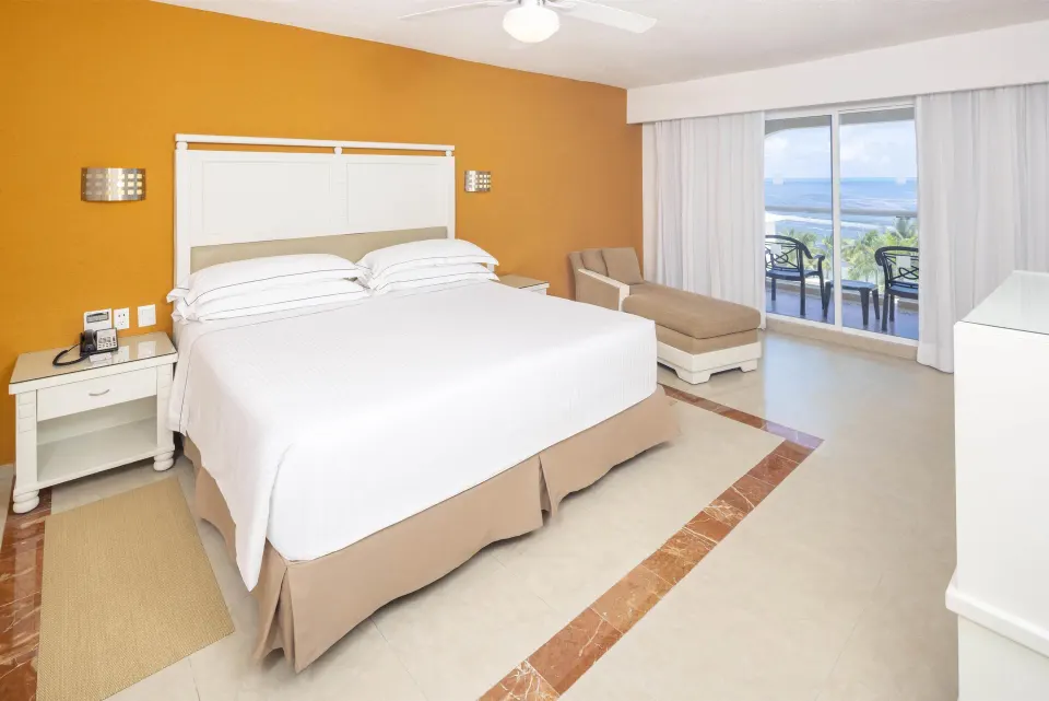 Sea View room with king bed and balcony at Occidental Costa Cancún.