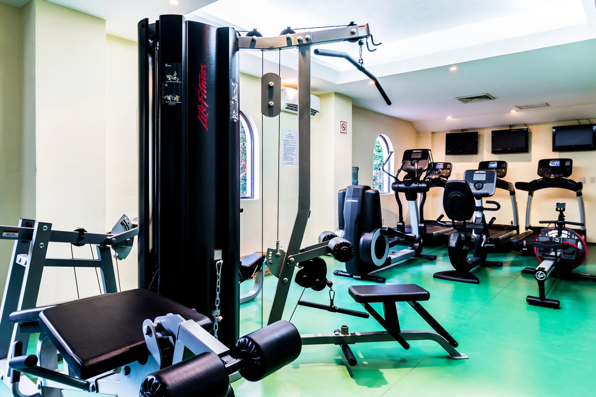 Fitness room with cardio and strength equipment at Occidental Cozumel.