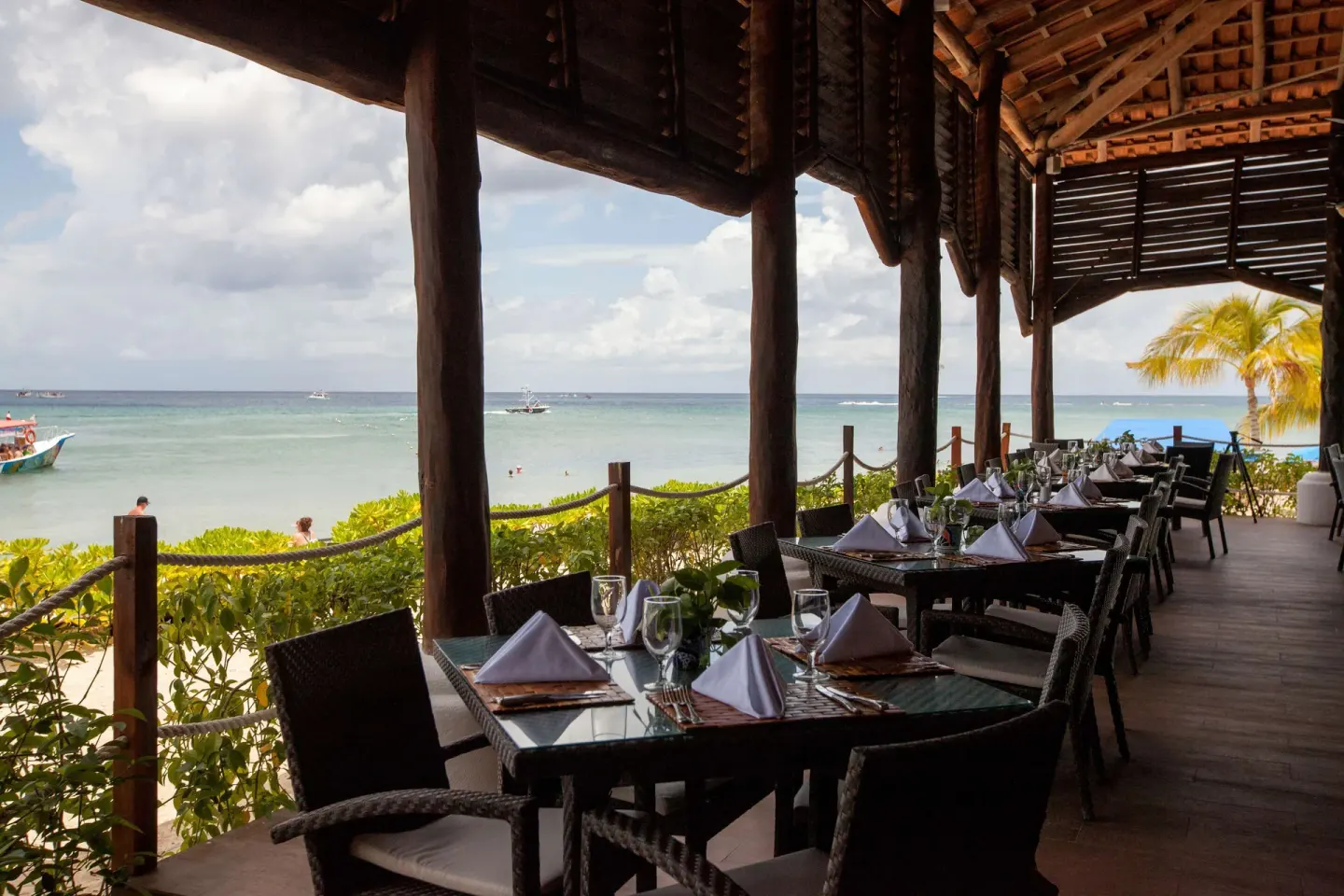 A beachfront terrace restaurant overlooks the sea at Occidental Cozumel.