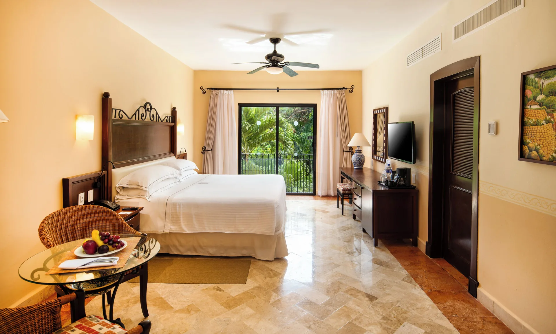 Deluxe Romance Room with king bed and balcony at Occidental Cozumel.
