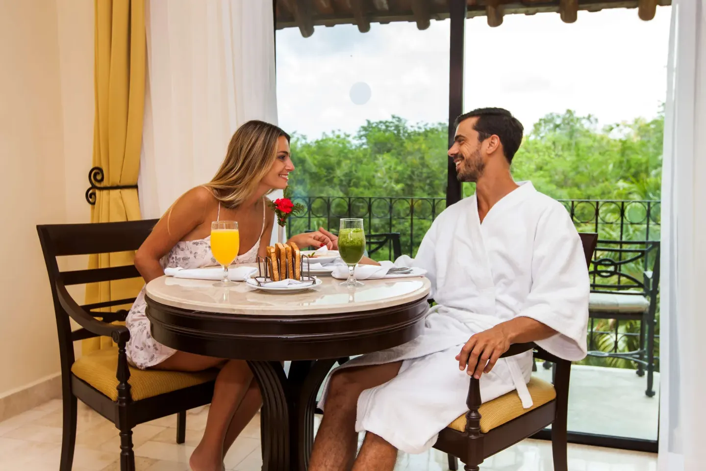 Royal Level Luxury room dining table by balcony at Occidental Cozumel.