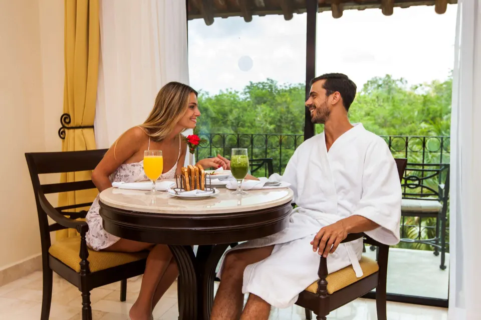 Royal Level Luxury room dining table by balcony at Occidental Cozumel.