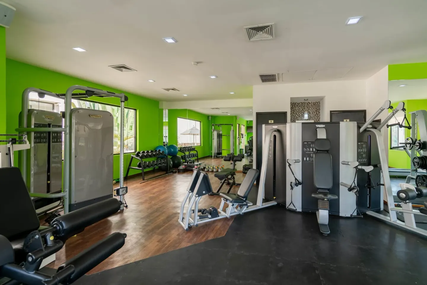 Fitness room with weight machines, benches, and dumbbells at Occidental Nuevo Vallarta.