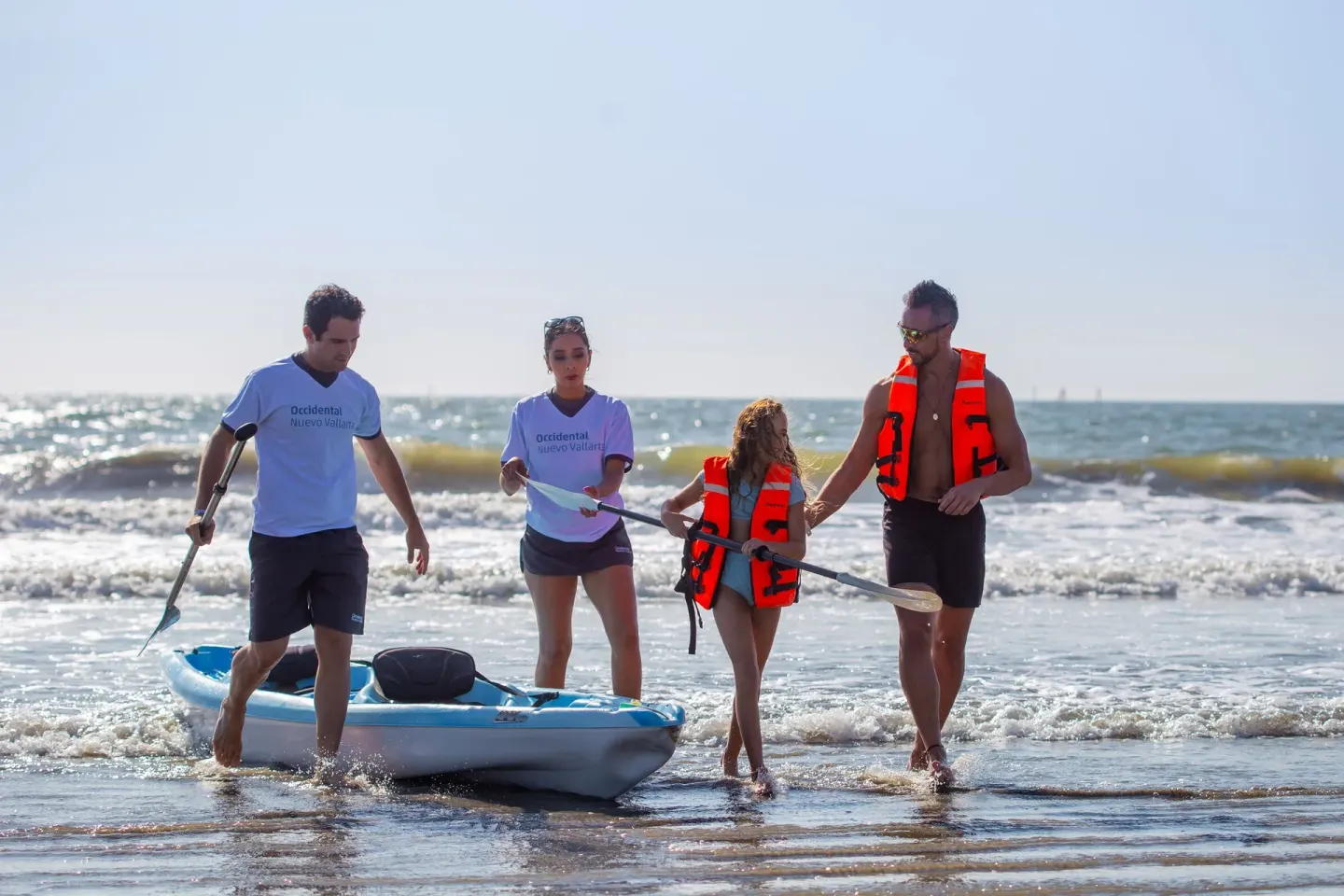 Guests prepare to launch a kayak from the beach at Occidental Nuevo Vallarta.