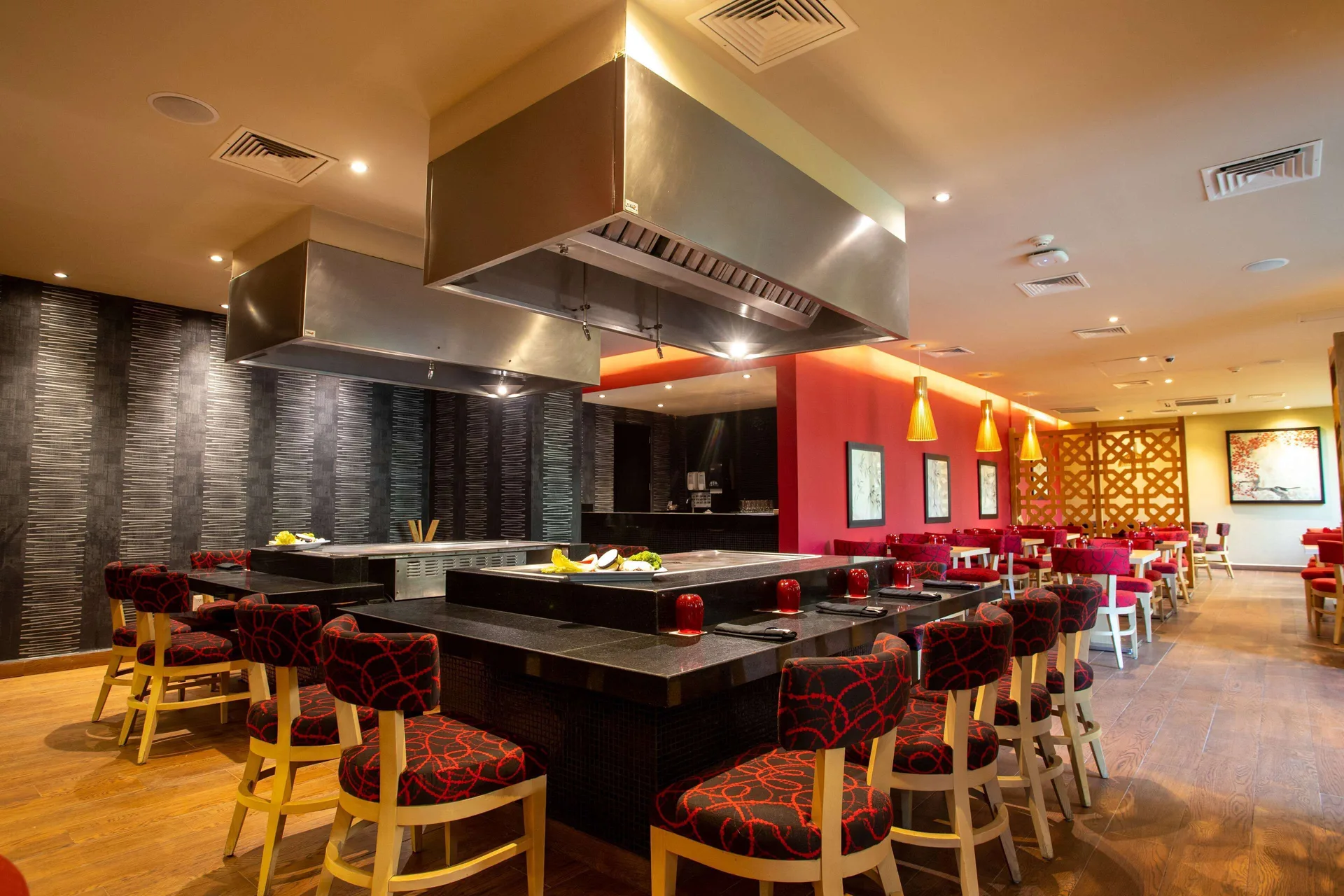 Japanese-style restaurant seating surrounds cooktops at Occidental Nuevo Vallarta.