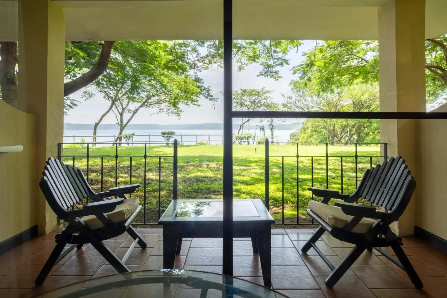 Deluxe Room Bay View terrace seating at Occidental Papagayo.