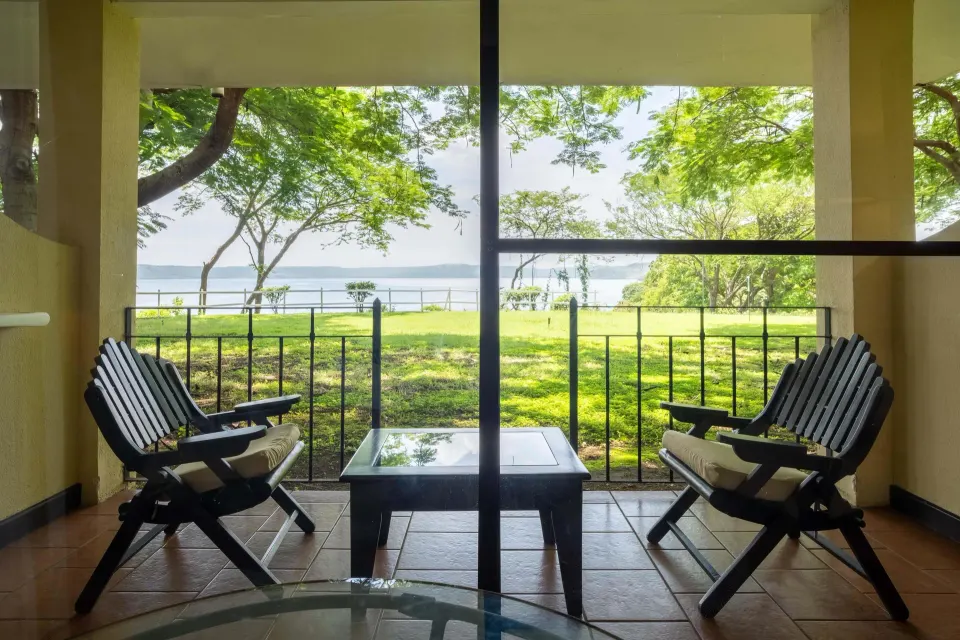 Deluxe Room Bay View terrace seating at Occidental Papagayo.