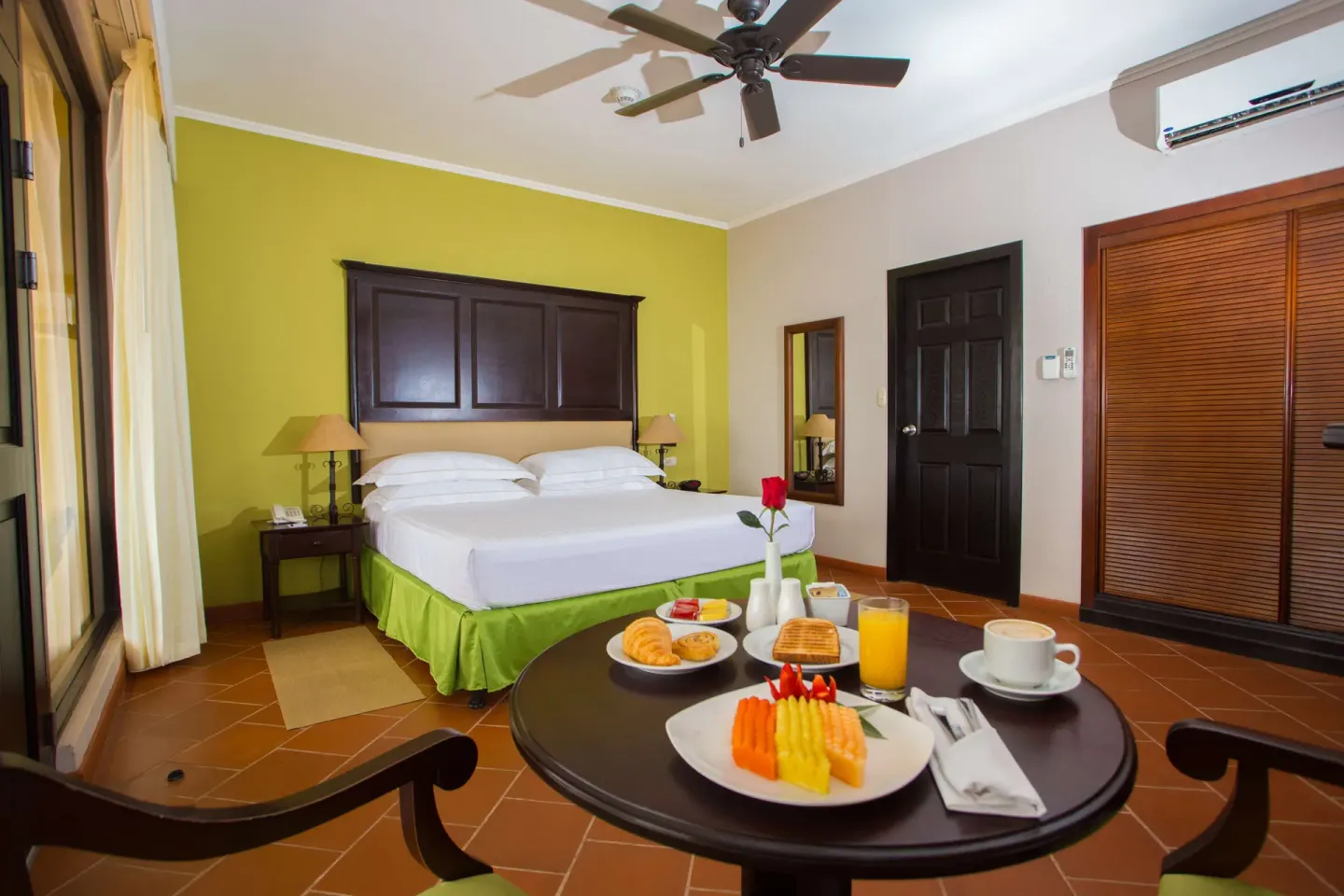 Premium Level Luxury room with king bed and breakfast table at Occidental Papagayo.