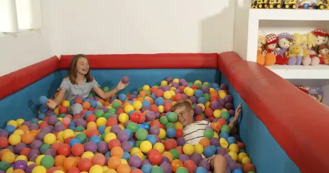 Children play in a colorful ball pit at Occidental Punta Cana.