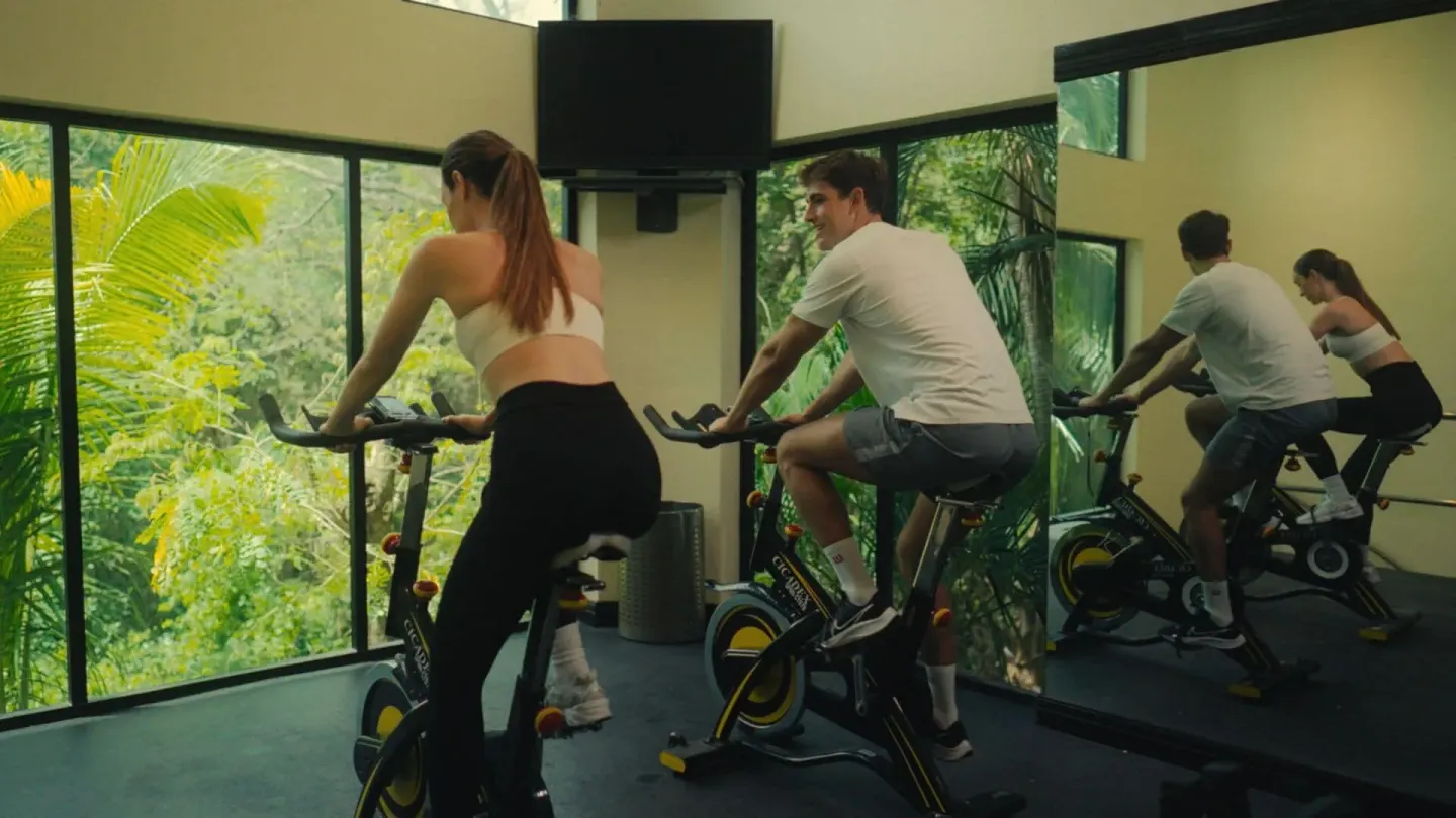 Guests using stationary bikes in the fitness room at Occidental Tamarindo.