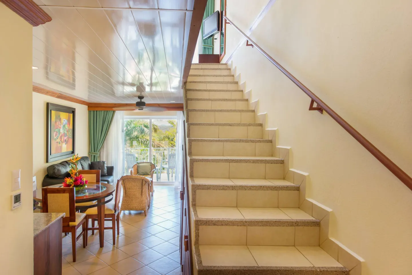 Duplex suite staircase leading from the living area at Occidental Tamarindo.