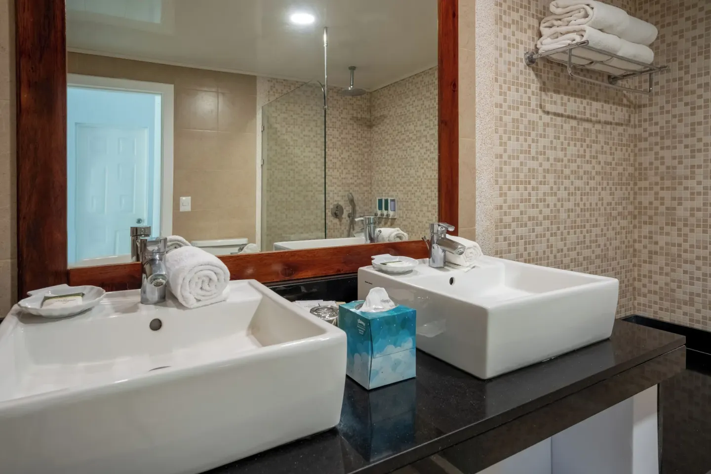 Superior Room bathroom with two square sinks and mirror at Occidental Tamarindo.