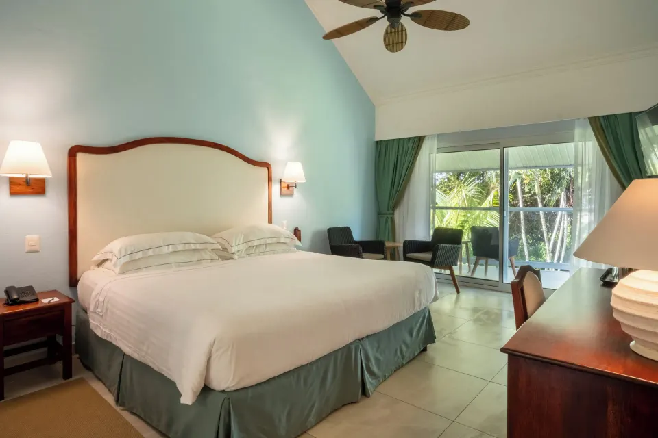Superior Room king bed and balcony doors at Occidental Tamarindo.