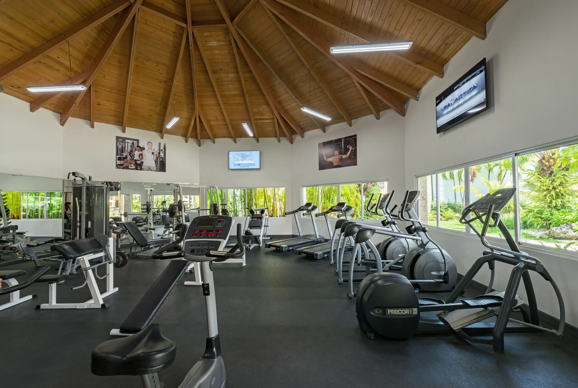 Fitness center with cardio and weight equipment at Ocean Blue & Sand Beach Resort.