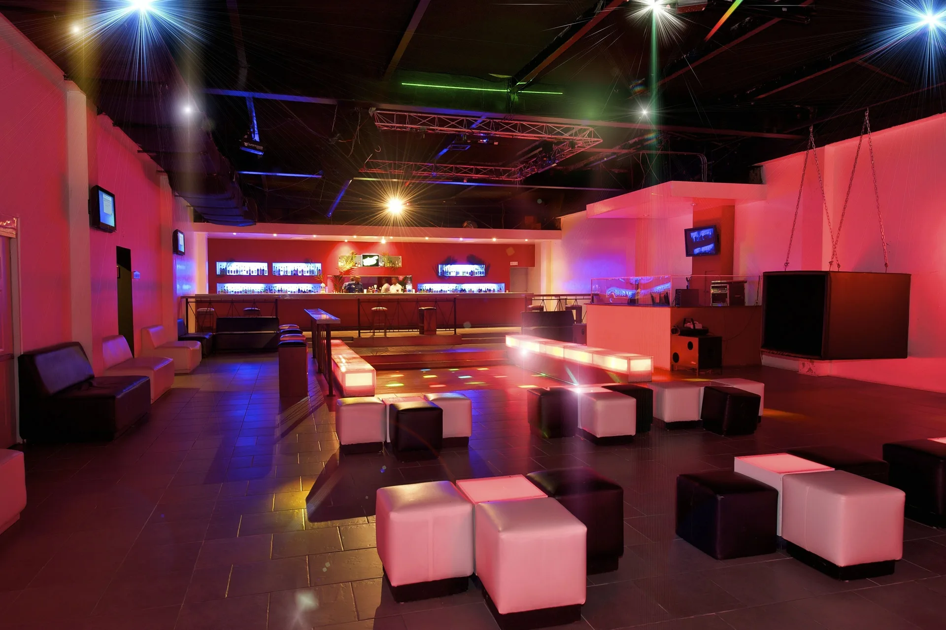 Colorful nightclub lounge with cube seating at Ocean Blue & Sand Beach Resort.