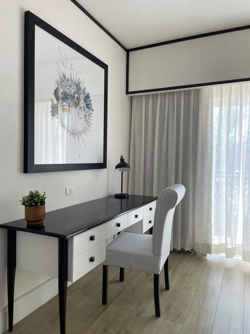 Junior Suite Nature View writing desk and chair at Ocean Blue & Sand Beach Resort.