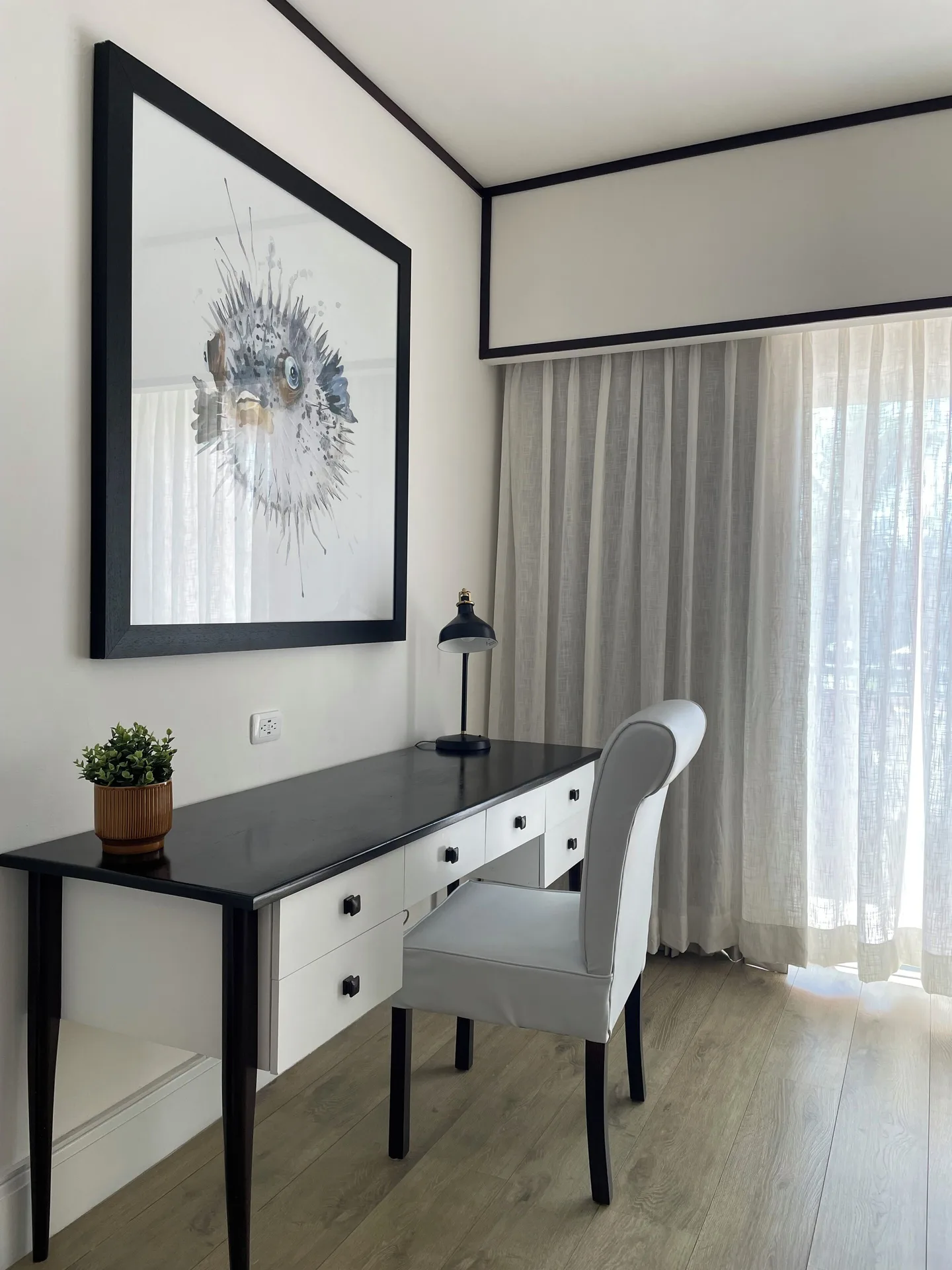 Junior Suite Nature View writing desk and chair at Ocean Blue & Sand Beach Resort.