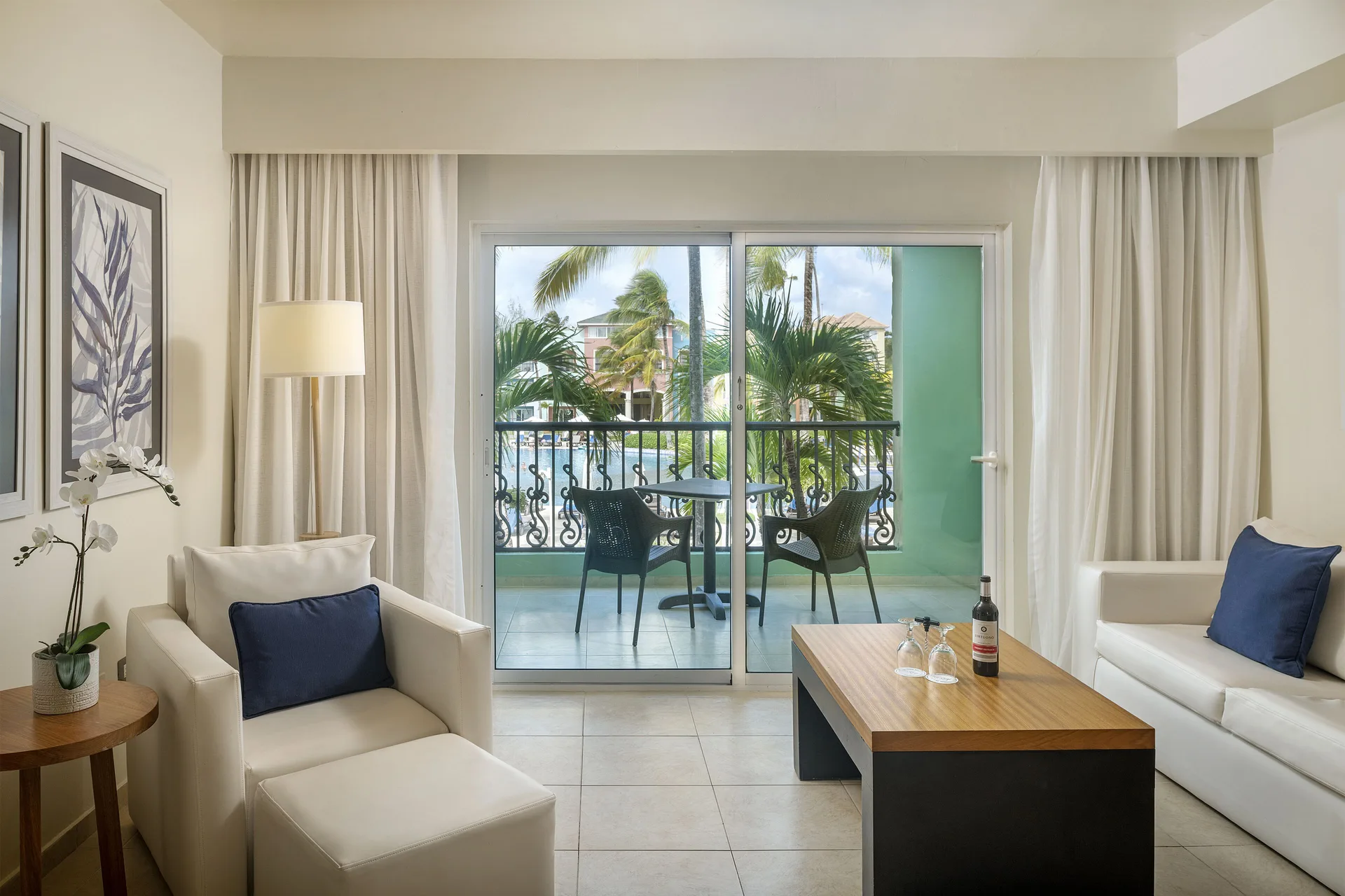 Privilege Junior Suite Nature View lounge and balcony seating at Ocean Blue & Sand Beach Resort.