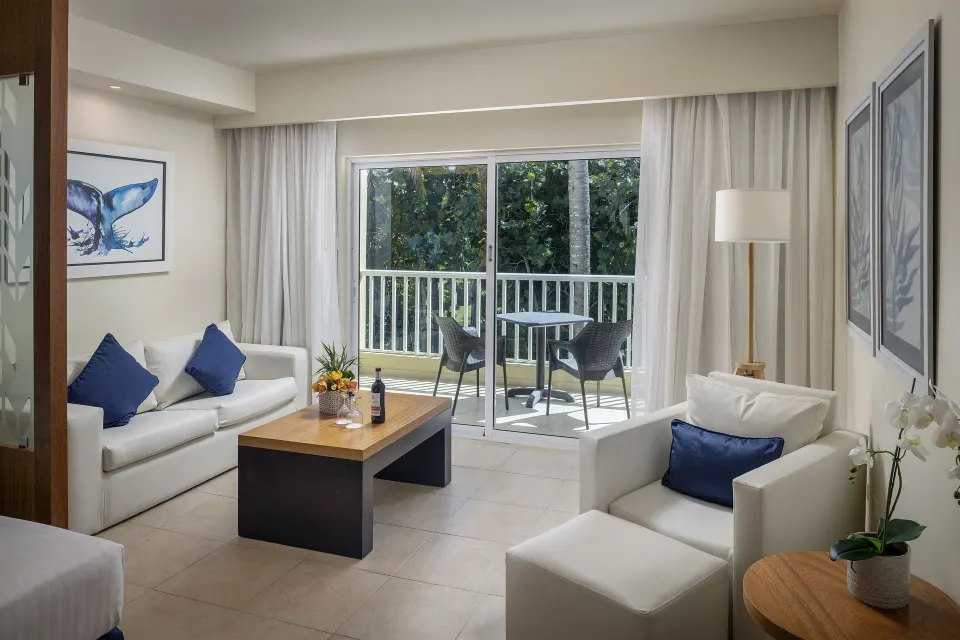 Privilege Junior Suite Nature View sitting area and balcony at Ocean Blue & Sand Beach Resort.