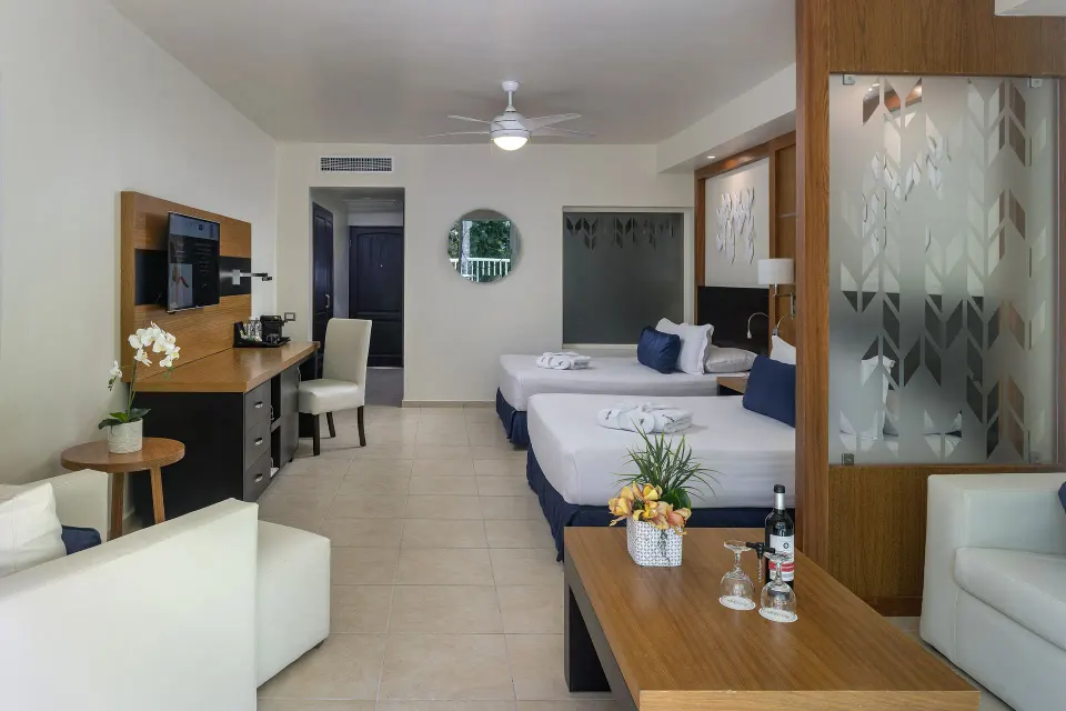 Privilege Junior Suite Nature View two beds and living area at Ocean Blue & Sand Beach Resort.