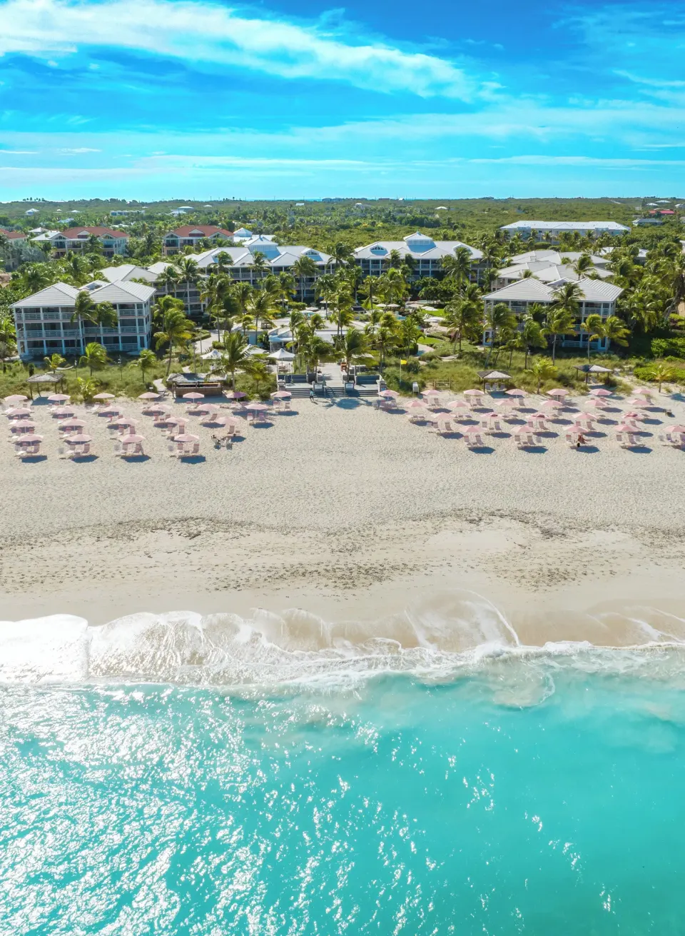 Aerial view of Ocean Club West, Grace Bay Beach facing Grace Bay Beach and turquoise water.