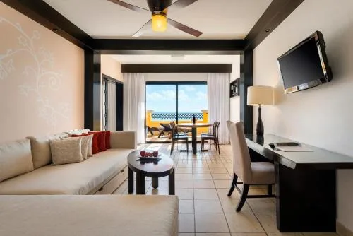 Suite living area with balcony ocean view at Ocean Coral and Turquesa.