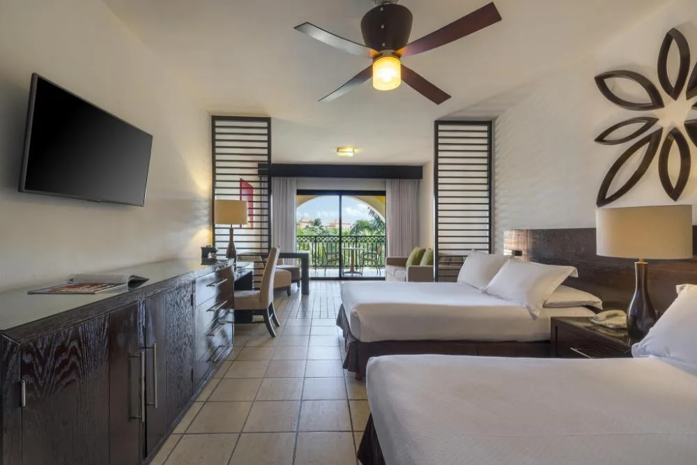 Junior Suite Waterpark Side with two beds and balcony at Ocean Coral and Turquesa.