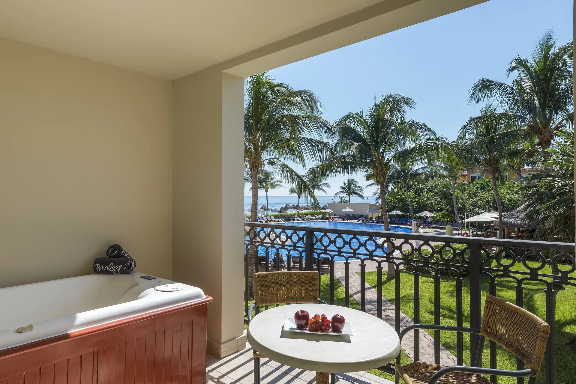 Privilege Junior Suite balcony with hot tub and pool view at Ocean Coral and Turquesa.