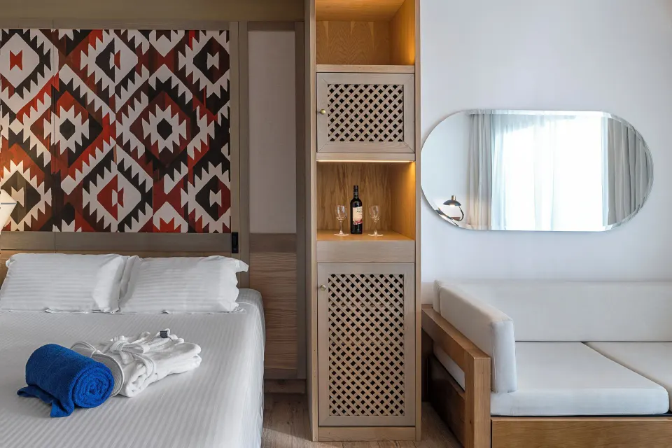 Privilege Junior Suite king bed and sitting area at Ocean Coral and Turquesa.