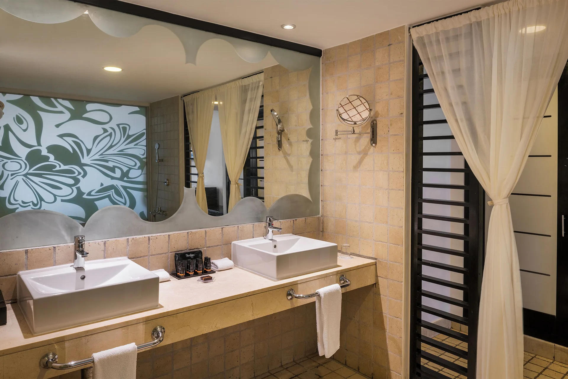 Privilege Master Suite Ocean Coral and Turquesa vanity and curtained bath area at Ocean Coral and Turquesa.