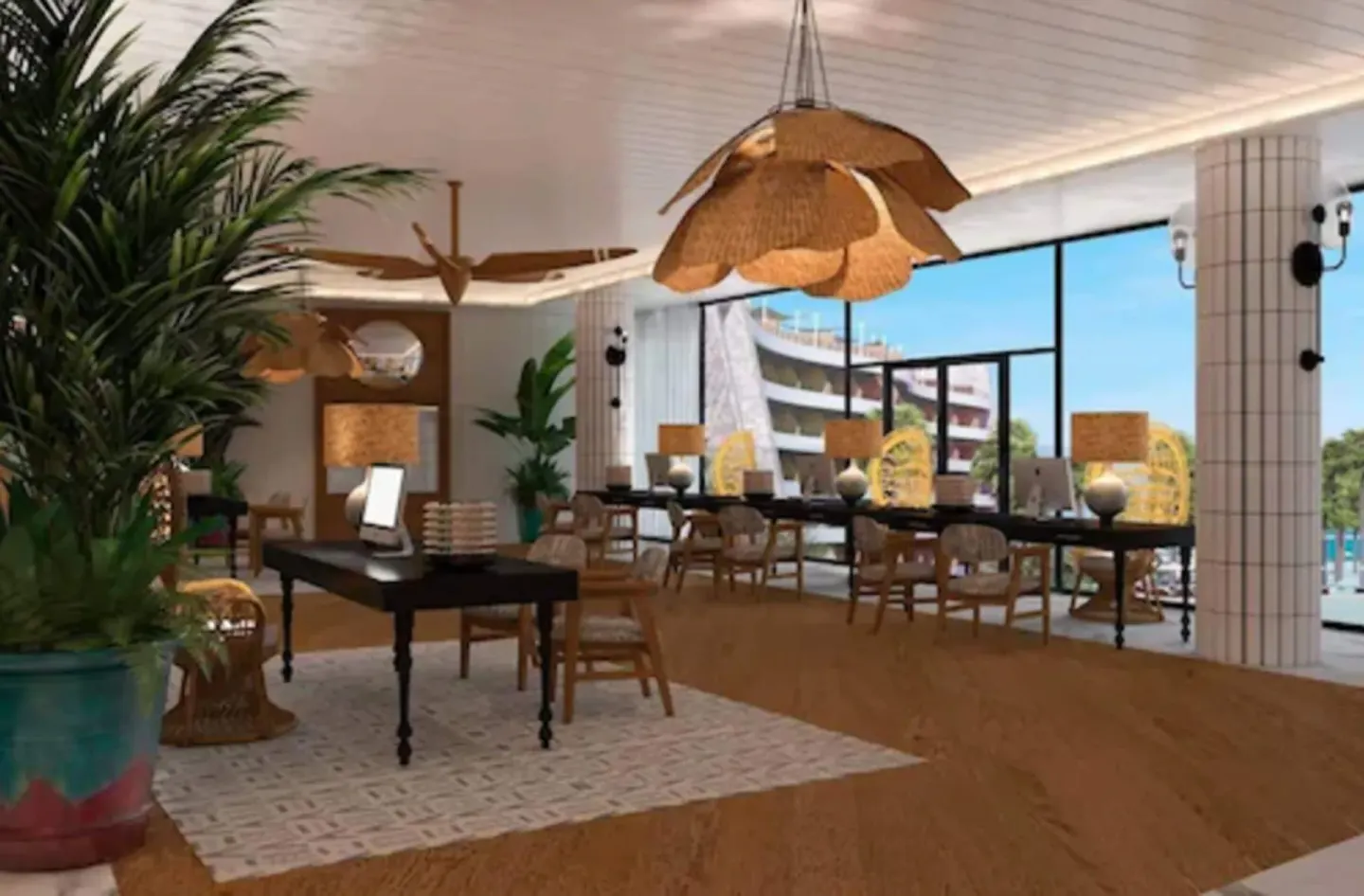Lobby seating area with large windows and tropical plants at Ocean Coral Spring.
