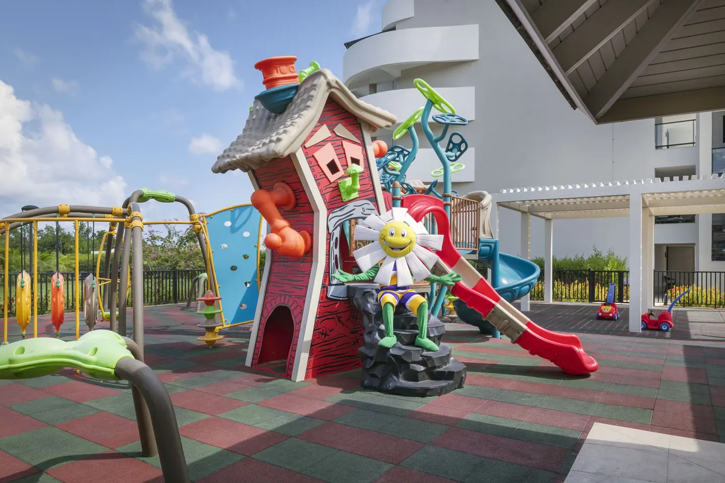 Outdoor children's playground with slides and climbing features at Ocean Coral Spring.