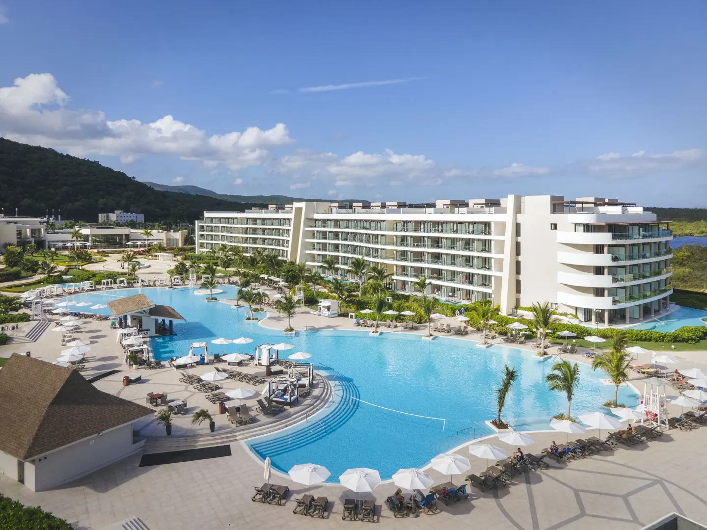 Elevated view of the pool complex and guest room balconies at Ocean Coral Spring.
