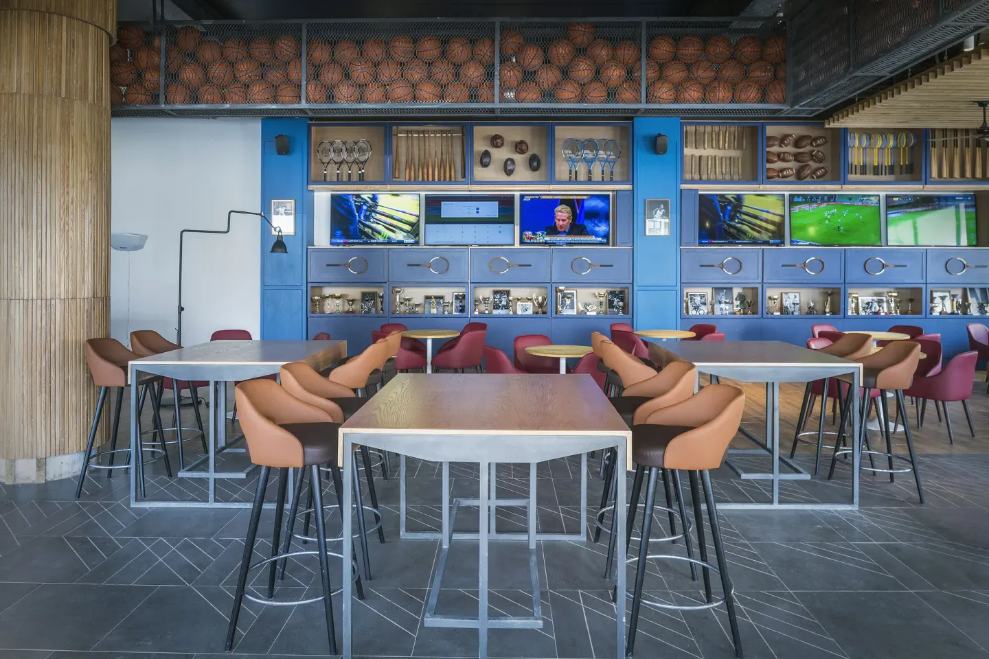 Sports bar seating with TVs and sports displays at Ocean Coral Spring.