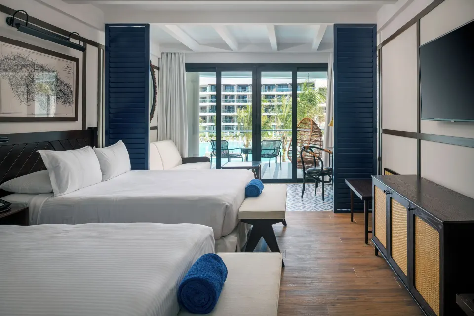 Junior Suite Pool View with two beds and balcony at Ocean Coral Spring.