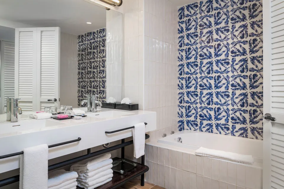 Junior Suite Waterpark bathroom with vanity and bathtub at Ocean Coral Spring.