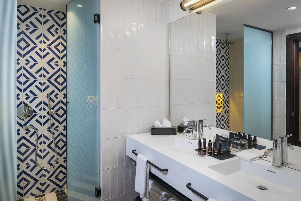 Privilege Junior Suite Nature View bathroom with double vanity at Ocean Coral Spring.