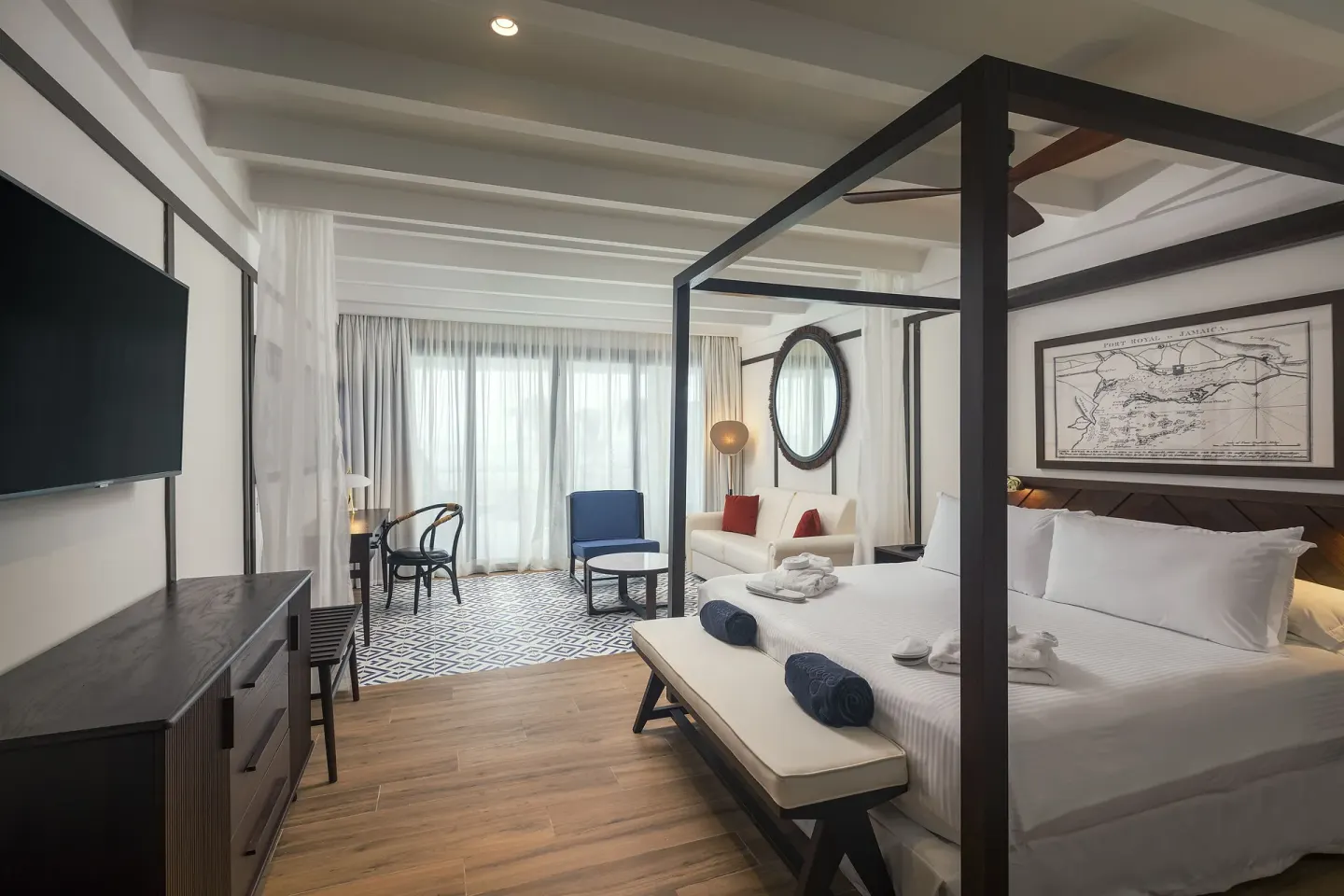 Privilege Junior Suite Nature View with canopy bed and sitting area at Ocean Coral Spring.