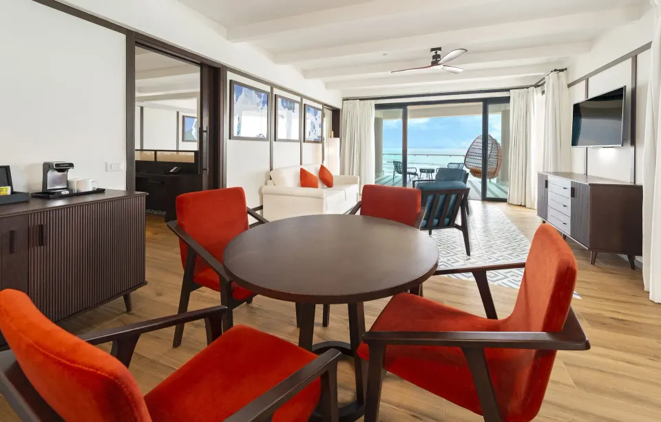 Privilege Master Suite living and dining area with ocean-view balcony at Ocean Coral Spring.
