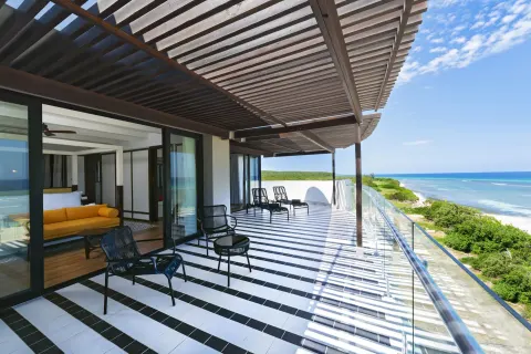 Privilege Master Suite rooftop terrace with seating and ocean view at Ocean Coral Spring.