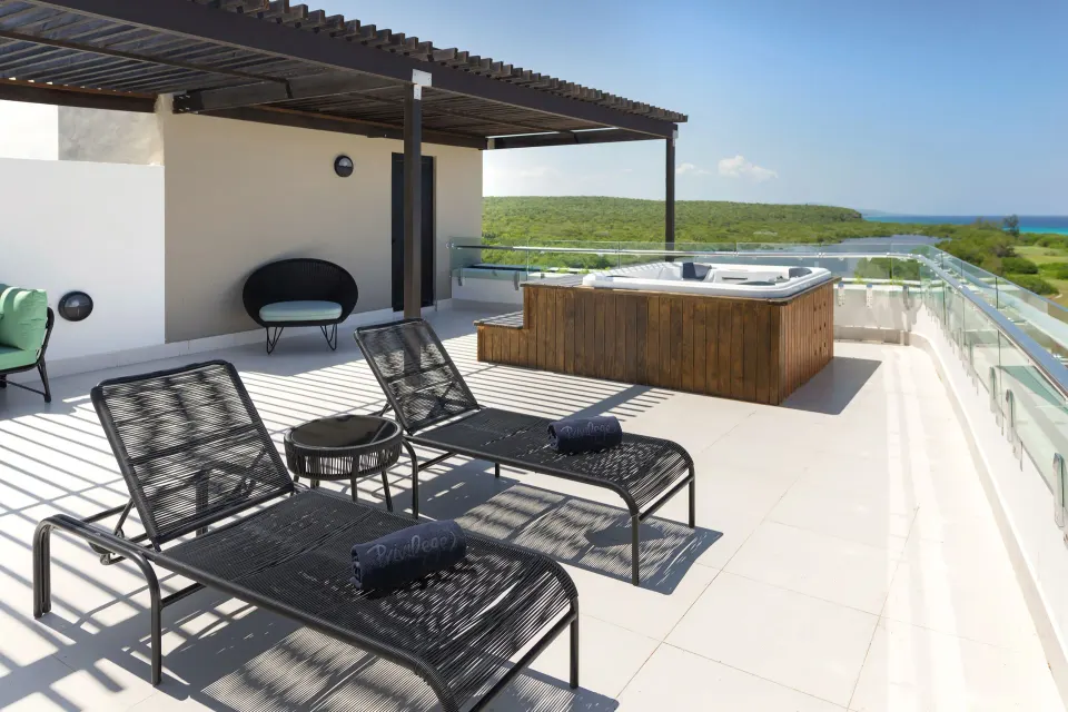 Privilege Master Suite rooftop terrace with loungers and hot tub at Ocean Coral Spring.
