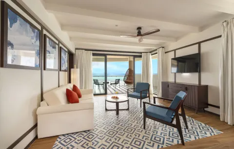 Privilege Master Suite sitting area with balcony seating and sea view at Ocean Coral Spring.