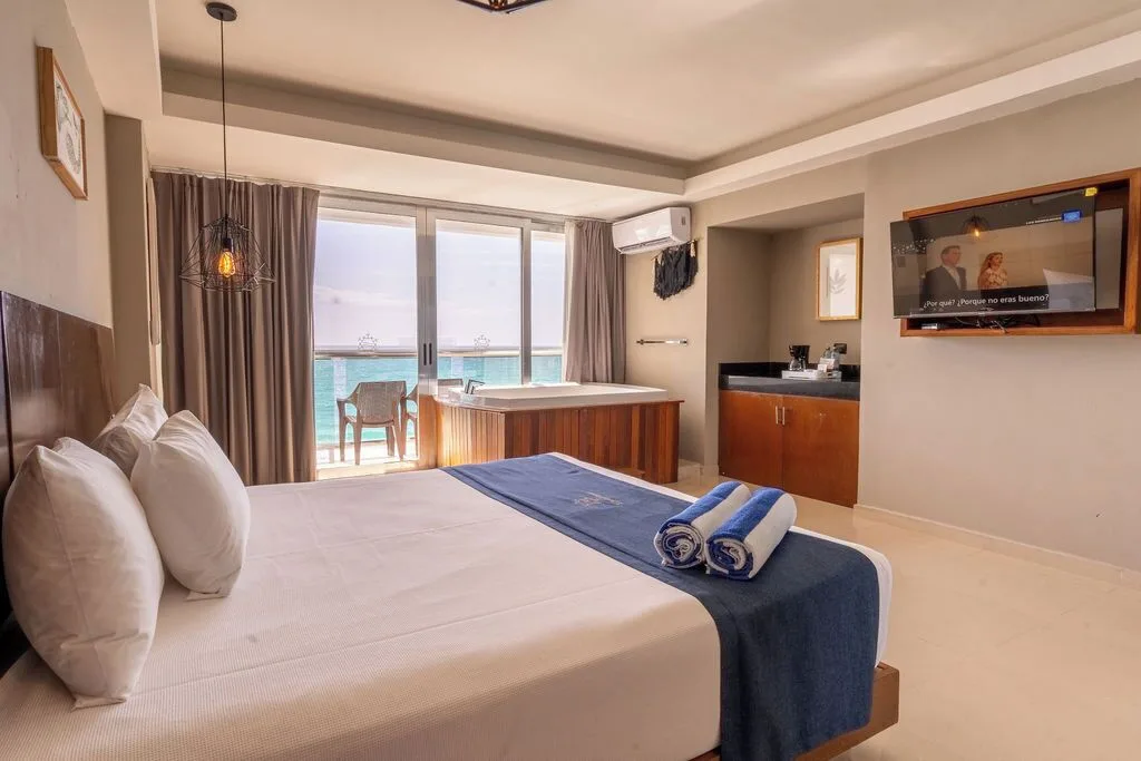 Deluxe room king bed with tub and balcony ocean view at Ocean Dream Cancun.